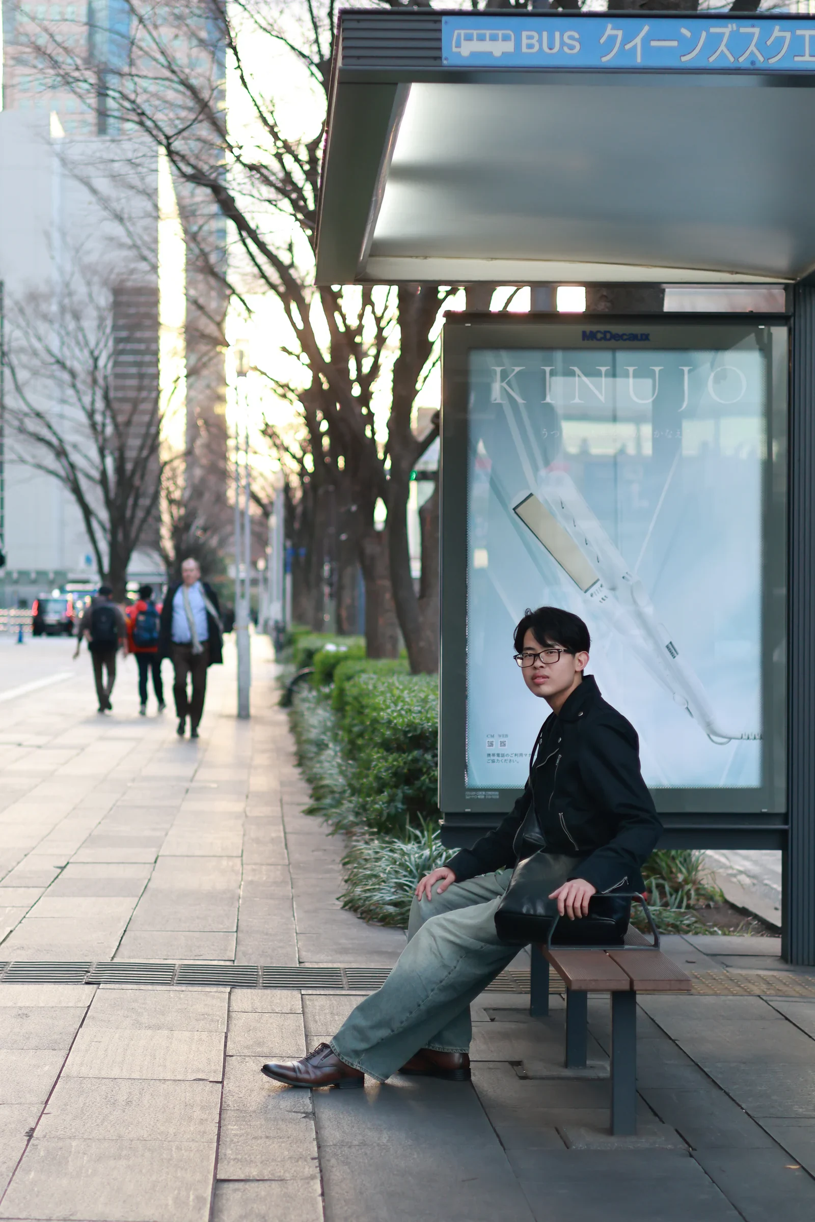 Yuto Matsui seated in a Yokohama streetscape